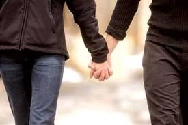 couple holding hands - couples sex coaching