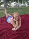 Nikki Lundberg relaxing outdoors and sharing how to get in the mood for sex